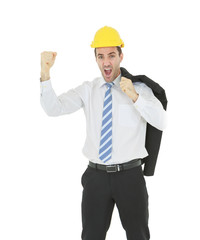 Standing smart engineer in white shirt wearing yellow helmet showing fist and shouting isolated on white background