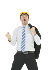Standing smart engineer in white shirt wearing yellow helmet showing fist and shouting isolated on white background
