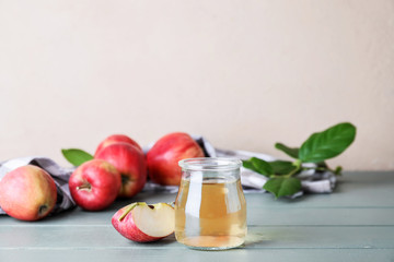 Jar of apple cider vinegar on table