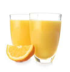 Glasses of fresh orange juice on white background