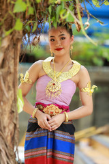 Asian teen girl in thai traditional dress.