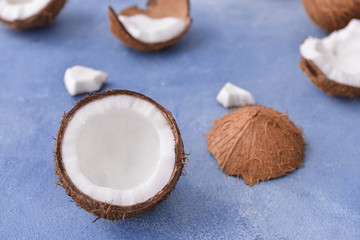 Fototapeta na wymiar Ripe coconuts on color background