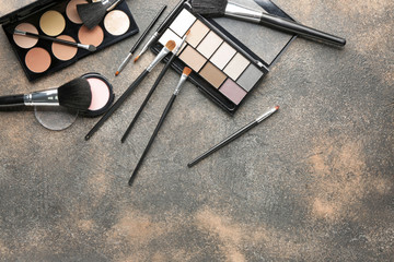 Set of decorative cosmetics on grunge background
