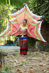 Asian teen girl in thai traditional dress.