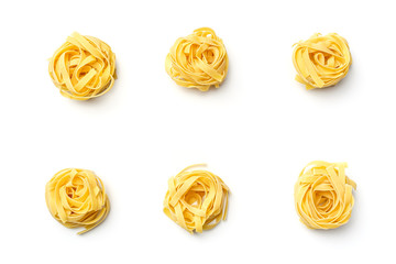 Obraz na płótnie Canvas Italian pasta fettuccine nest isolated on white background