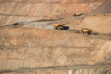 Trucks working in the Super Pit, a gold mine in Kalgoorlie, Western Australia © Michael Evans
