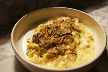 Close up sliced Black truffle topped on Carbonara Spaghetti