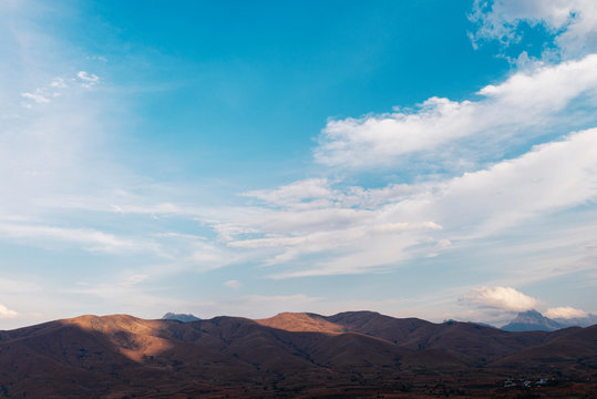 Deserted landscape of dry hills on a cloudy day at sunset, Fianarantsoa, Madagascar