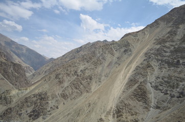 the view of Himalaya mountains on a sunny day under the blue sky in the morning or the evening in Tibet India China the road on high altitudes