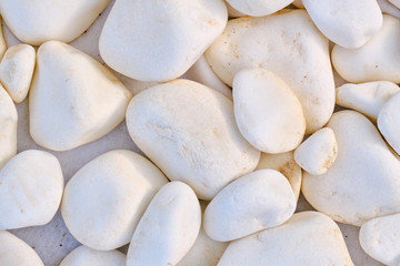 Round stone texture, close-up. Texture of large stones. Background in the form of white rock.