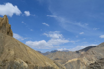 the view of Himalaya mountains on a sunny day under the blue sky in the morning or the evening in Tibet India China the road on high altitudes
