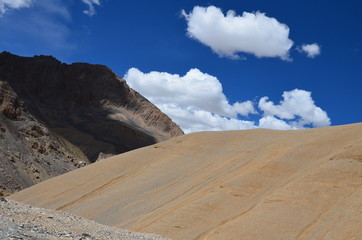 the view of Himalaya mountains on a sunny day under the blue sky in the morning or the evening in Tibet India China the road on high altitudes