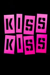 Pink stencil letters spell out Kiss Kiss on black background