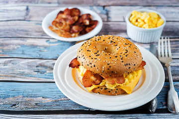 Fried bacon cheese egg salad bagel