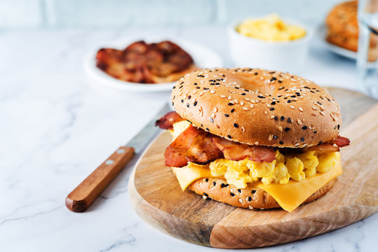 Fried bacon cheese egg salad bagel