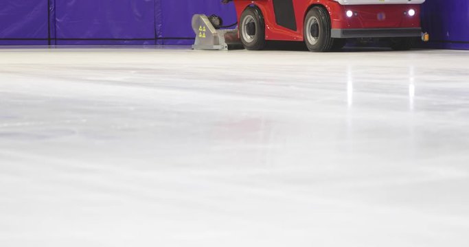 Footage of an ice-resurfacing machine polishing the rink
