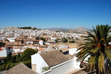 Fototapeta na wymiar View over the town rooftops looking North West towards the Lovers Rock (Pena de los Enamorados), Antequera, Spain.