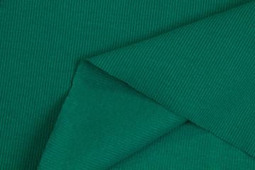 Fabric cotton fold, top view. Green textile