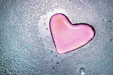 Valentine's day concept. accumulation of water drops in the form of a heart on a metal surface.