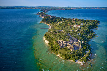 Flight of the Archaeological site of Grotte di Catullo, Sirmione Lake Garda, Italy. Drone video recording