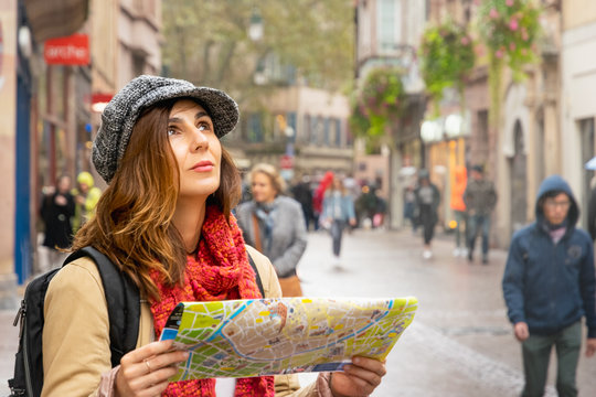 Traveler woman with map in vacation.
