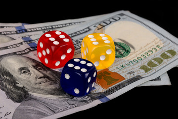 colored DICE on the dollar on black background