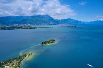 Panoramic view of the island of San Biagio, Italy. Lake Garda, blue sky	