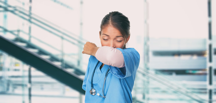 Novel Coronavirus 2019-nCoV Wuhan chinese hospital nurse or Asian doctor woman worker sneezing into arm covering mouth and nose while coughing flu. Virus protection prevention panoramic banner.