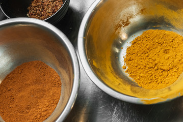 fragrant spices in metal bowls