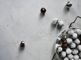 Homemade raw chocolate crinkles on a white background, on confectionery grill . copy space