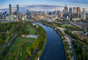 Aerial panoramic view of rowers training in the pre-dawn light on the Yarra river, with the city of Melbourne in the background © Michael Evans