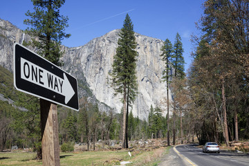 One way road sign in Yosemite Park, California. El Capitan in the background