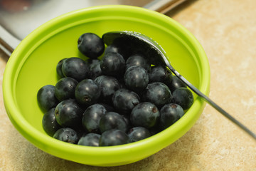 green bowl of fresh juicy grapes 