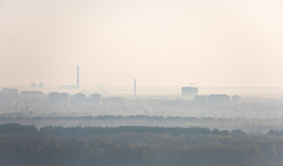 Fototapeta premium Hazy morning view on left riverside of Dnieper river in Kyiv, Ukraine.