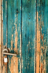 Old wooden door painted green