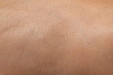 Macro of human skin textuew, an extreme close up of foot skin of a young woman