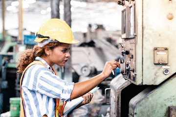 Industrial Engineers in Hard Hats.Work at the Heavy Industry Manufacturing Factory.industrial...