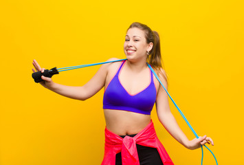 young blonde woman with a jump rope. sport concept