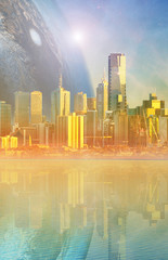 Fantasy landscape modern megapolis skyline and huge alien planet reflecting in tranquil waters at sunset. Elements of this image are furnished by NASA