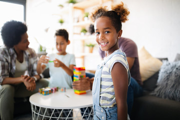 Happy black family having fun times at home