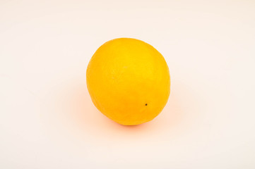 Ripe yellow lemon on a white background. Close up.