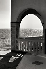 Architectural details of white houses on the shore
