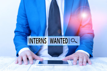 Text sign showing Interns Wanted. Business photo showcasing temporary position with an emphasis on...