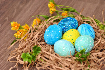 Spring Easter colorful painted eggs on the wooden background flat lay closeup top view beautiful picture. Congratulations card happy holiday