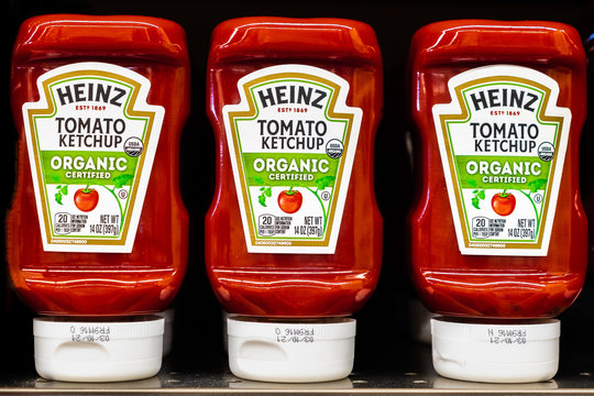 Feb 7, 2020 Santa Clara / CA / USA - Close up of Heinz Tomato Ketchup bottles displayed on a shelf in a supermarket; Heinz Tomato Ketchup is a brand of ketchup produced by the H. J. Heinz Company