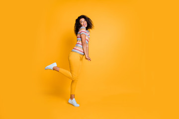 Full length body size profile side view of nice attractive cheerful cheery girlish shy wavy-haired...