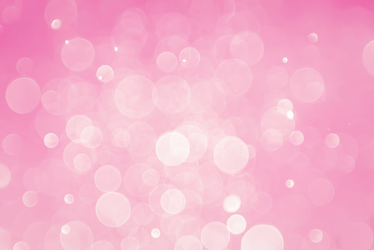 abstract bokeh light effect with pastel gradient pink background