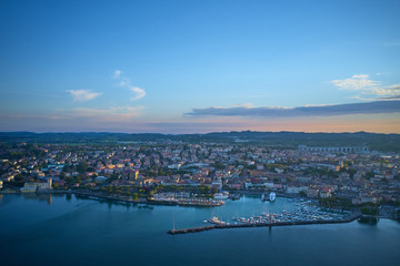 Aerial view of the city center of Desenzano del Garda, Italy. The main lighthouse of the city, boat parking in the city center