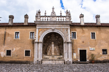 Fototapeta na wymiar Padula, Salerno, Campania, Italy - May 21, 2017: Facade of the external court in the Certosa di San Lorenzo