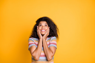 Close-up portrait of her she nice attractive cheerful cheery girlish wavy-haired girl in striped tshirt looking up touching face wow isolated on bright vivid shine vibrant yellow color background